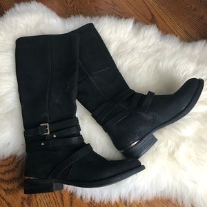Black riding boots with gold buckle